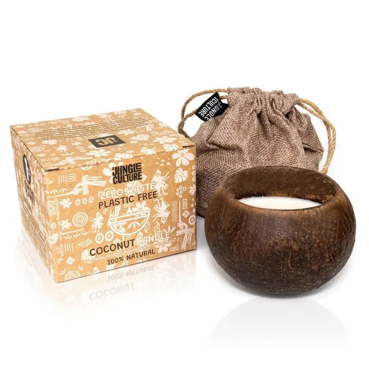 Coconut candle in a shell with packaging and drawstring bag on a white background