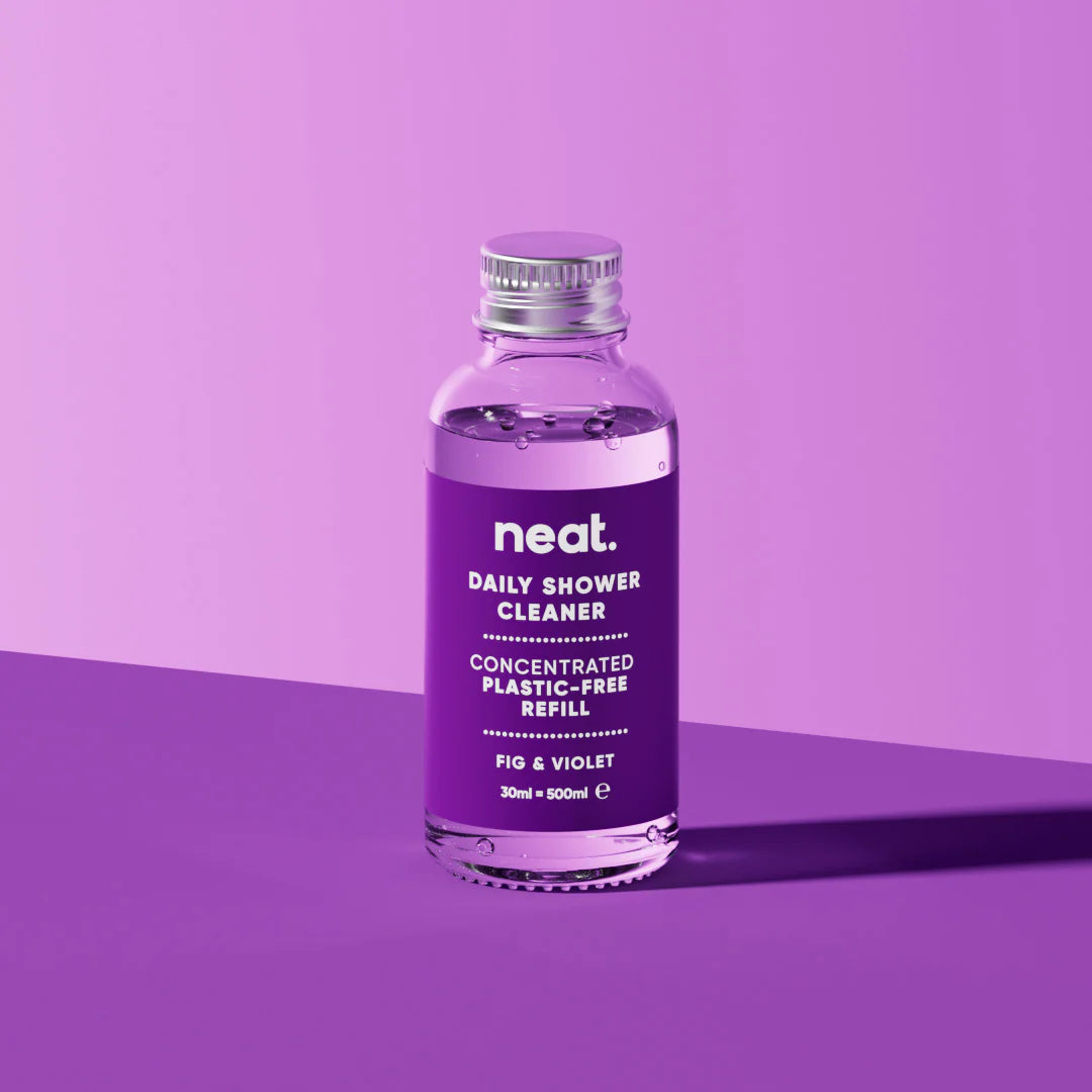 Purple bottle of 'neat' daily shower cleaner on a purple background