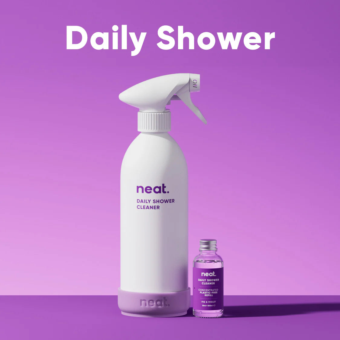 White spray bottle labeled 'neat' on a purple background